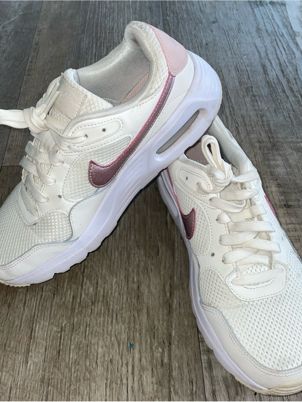 Nike Women's White Sneakers with Metallic Pink Swoosh